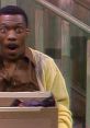 Surprised character from "Mr. Robinson's Neighborhood" excitedly discovering a box on the stairs, showcasing humor and surprise.